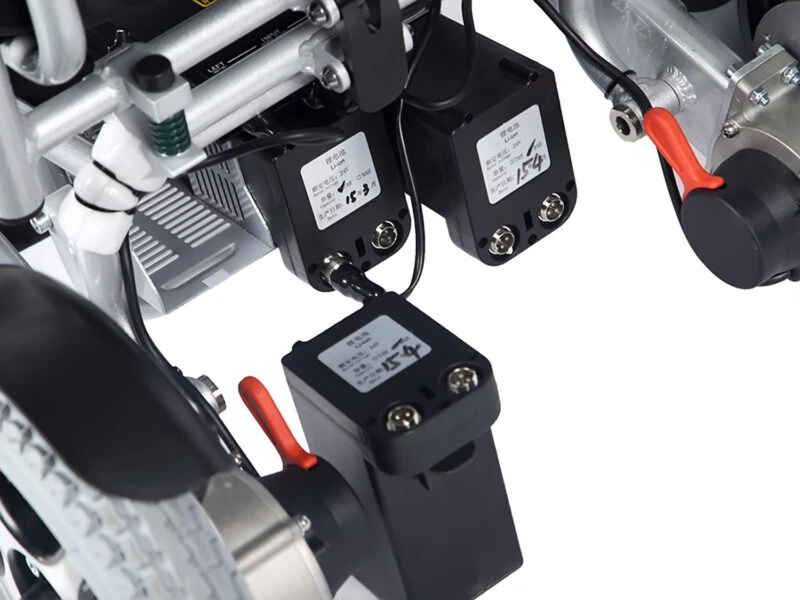 Close-up of the Freedom Chair A08's battery and wiring components.