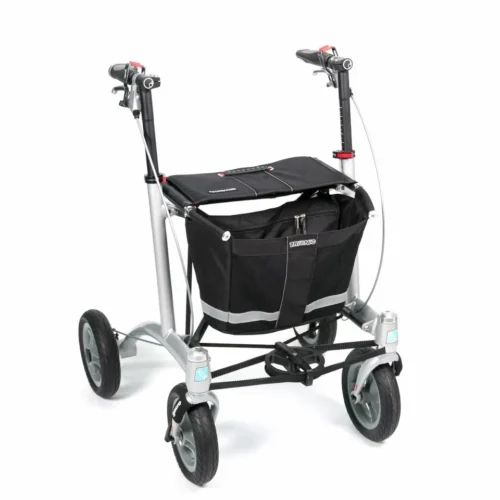 Trionic Walker 9er with black seat and basket, silver frame, and four wheels.