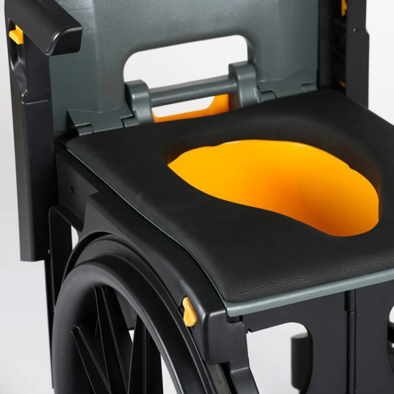 Close-up of a wheelable commode with a small aperture seat.