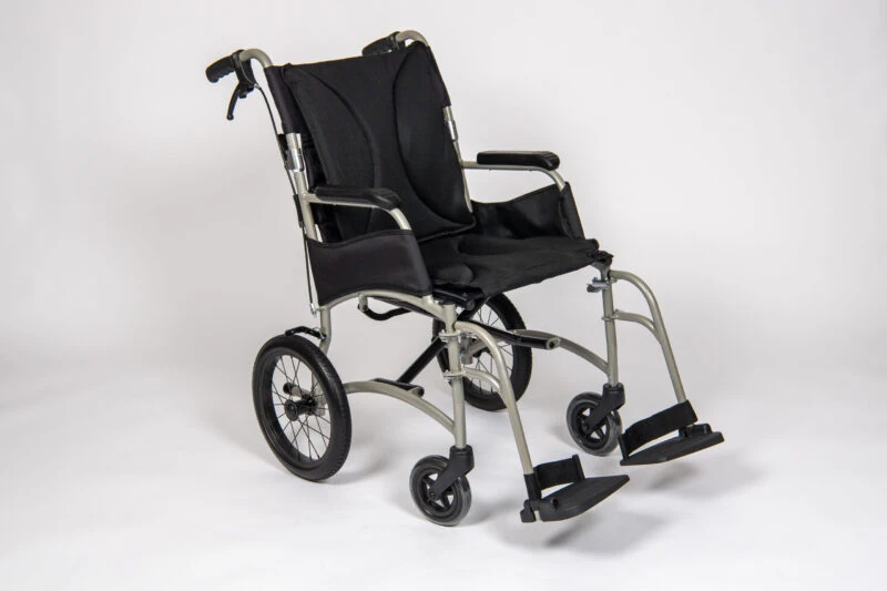 Lightweight transit wheelchair with folding frame and ergonomic seat.