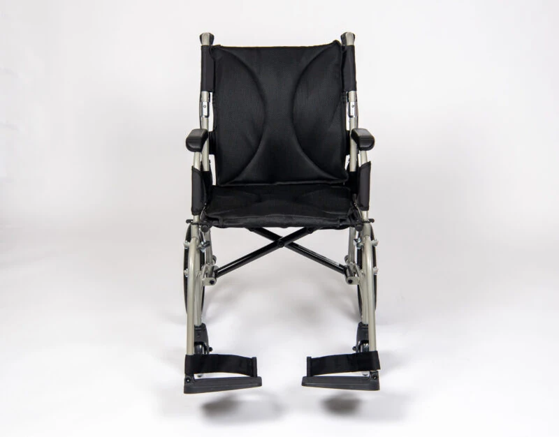 Front view of a black lightweight transit wheelchair with footrests.