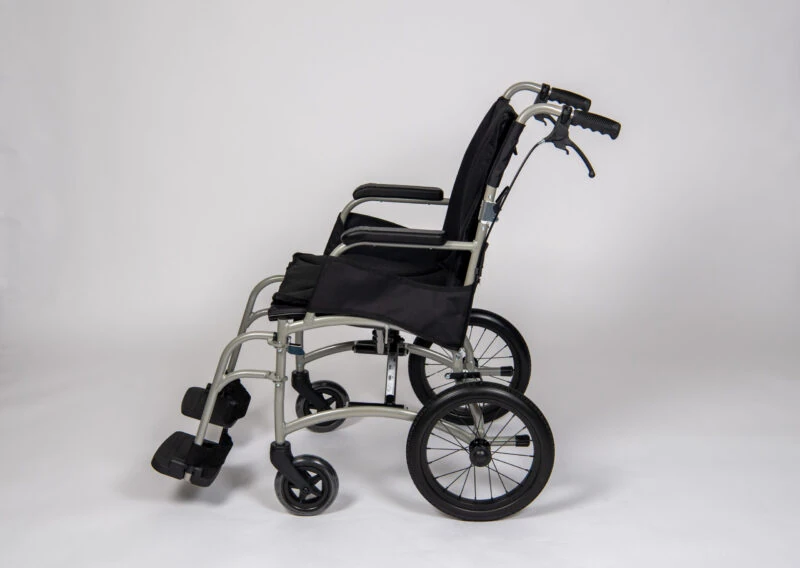 Side view of a lightweight transit wheelchair with black seat and silver frame.