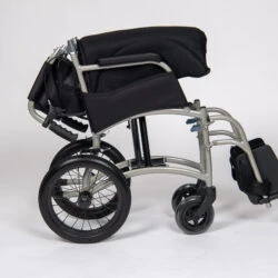 Folded lightweight transit wheelchair with black seat and wheels.