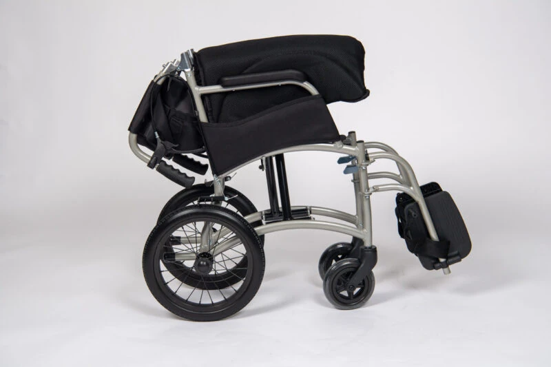 Folded lightweight transit wheelchair with black seat and wheels.