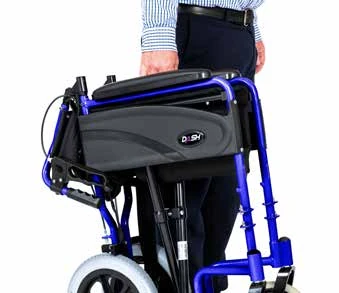 Person holding a folded Dash Express Folding Wheelchair.