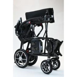 Folded Dash Carbon Pro Electric Wheelchair showing compact design.