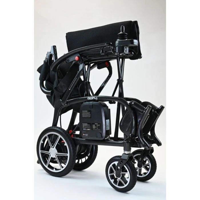 Folded Dash Carbon Pro Electric Wheelchair showing compact design.