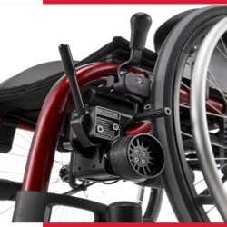 Close-up of electric wheelchair's rear wheel and motor mechanism.