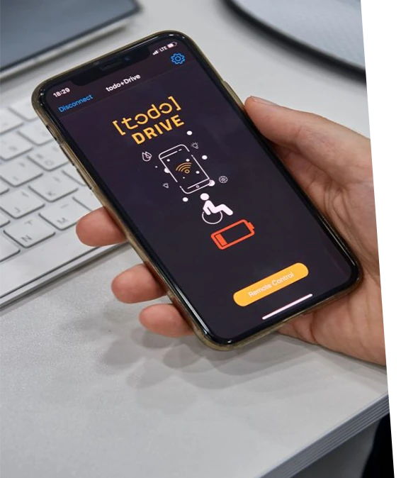 Smartphone displaying Todo Drive app interface for wheelchair control.