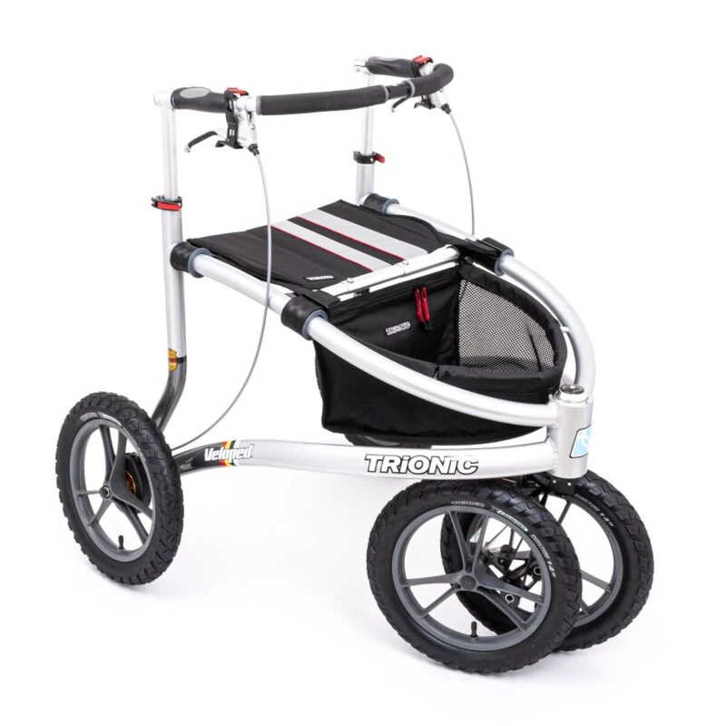 Trionic Veloped Tour 14er rollator with large wheels and storage basket.