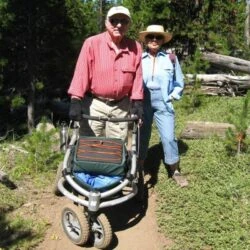 Two people with a Trionic Veloped Trek 12er on a forest trail.