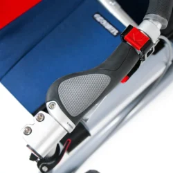 Close-up of ergonomic grip on Trionic Veloped Trek 14er with blue fabric in the background.