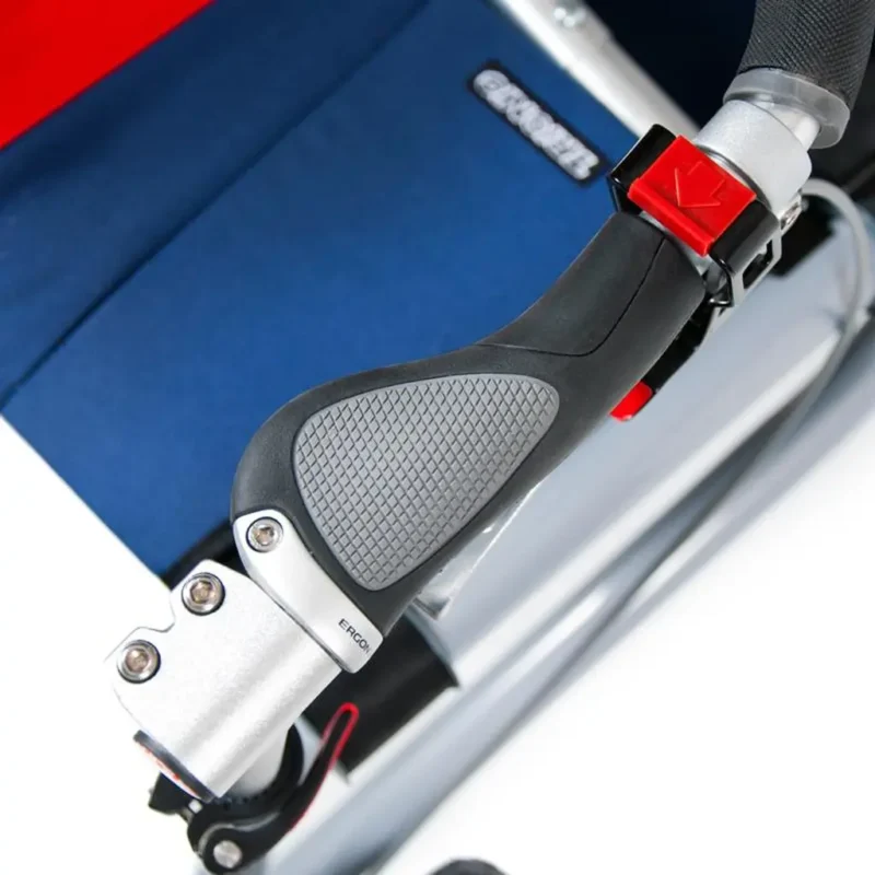 Close-up of ergonomic grip on Trionic Veloped Trek 14er with blue fabric in the background.