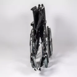 Folded bariatric wheelchair with black frame and large wheels.