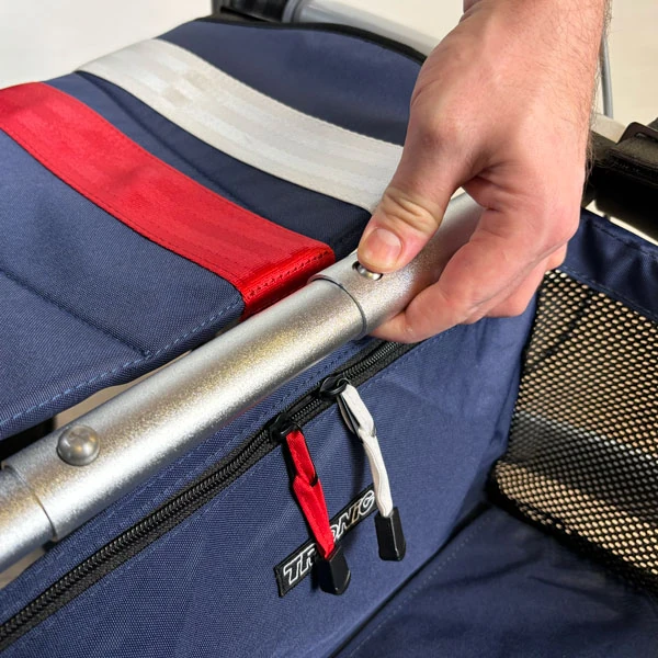 Close-up of a hand adjusting the handle on a Trionic Veloped Trek 12er.