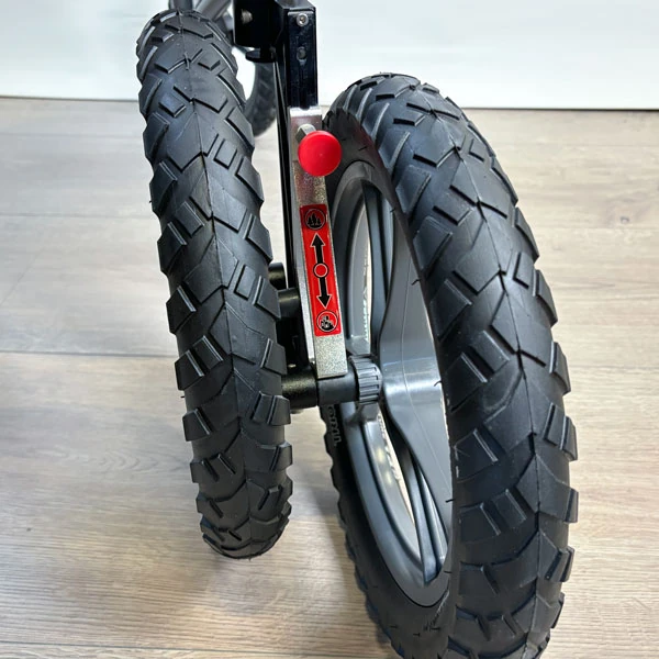 Close-up view of two large off-road wheels on the Trionic Veloped Trek 14er.