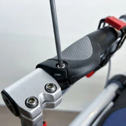 Close-up of a Trionic Veloped Trek 12er handle being adjusted with a tool.
