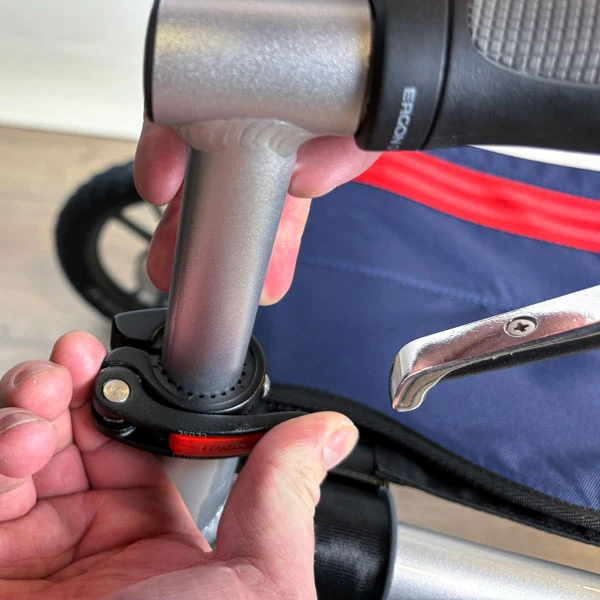 Close-up of a person adjusting the handle of the Trionic Veloped Trek 14er.
