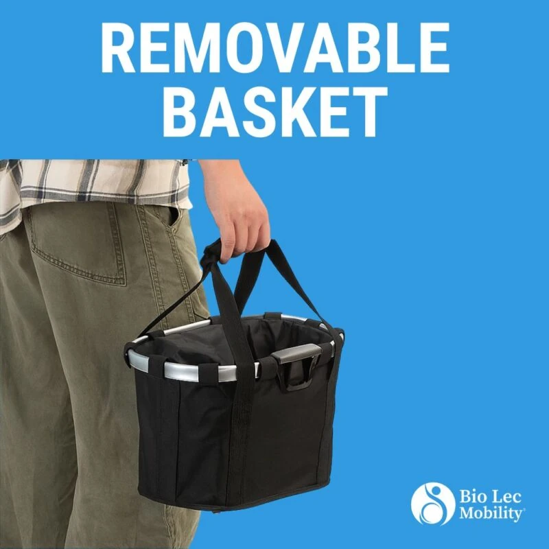 Person holding a removable black basket with handles.