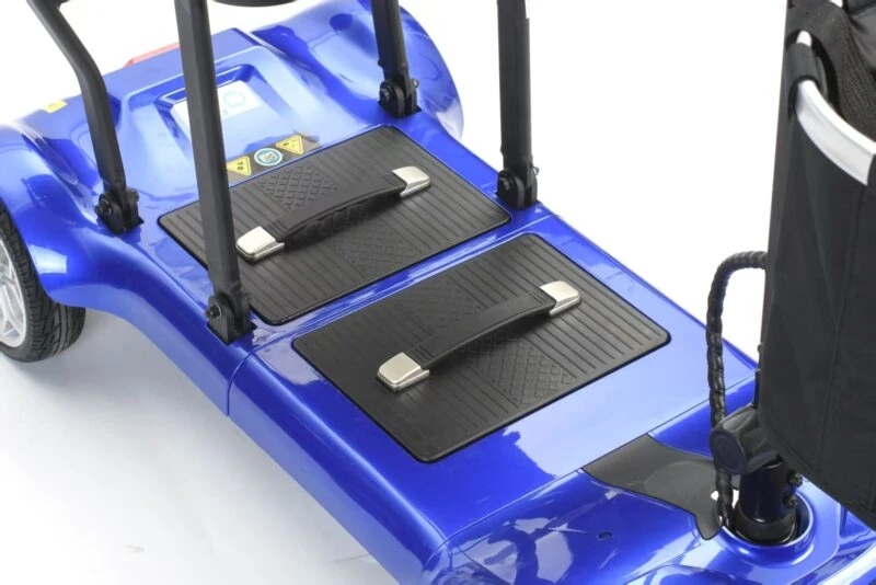 Close-up of the blue base of a foldable mobility scooter with footrests.