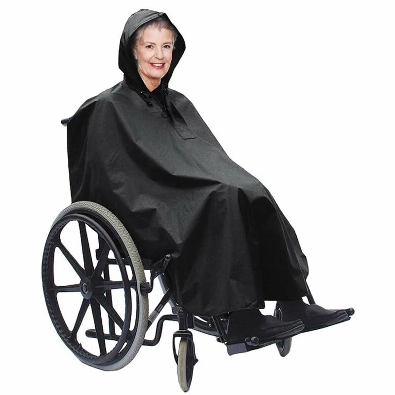 Person in wheelchair wearing a black waterproof poncho with hood.