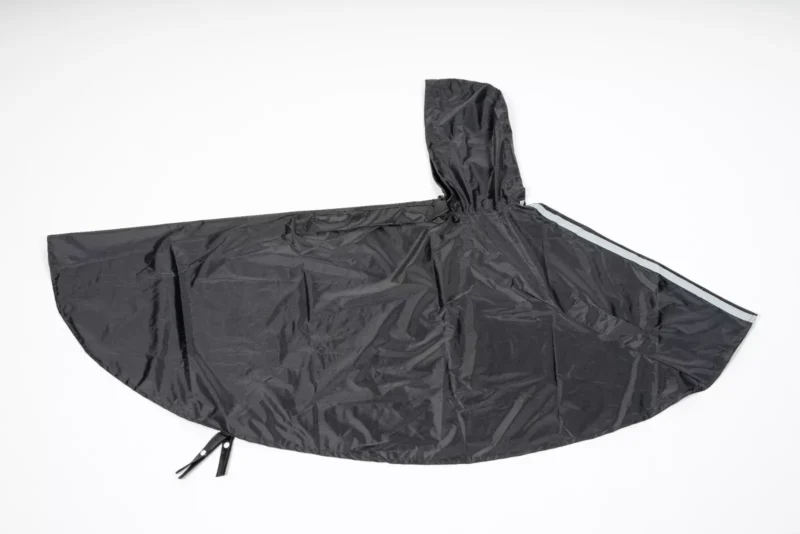 Black waterproof poncho with hood and reflective straps.