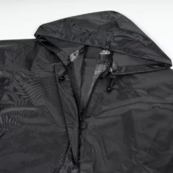 Black waterproof poncho with hood and zipper.