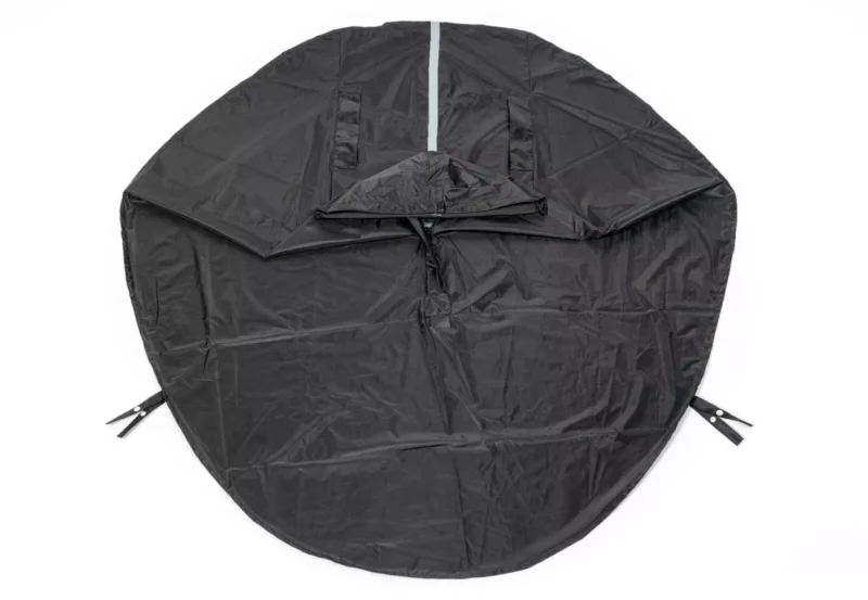 Black waterproof poncho with a hood and reflective strip.