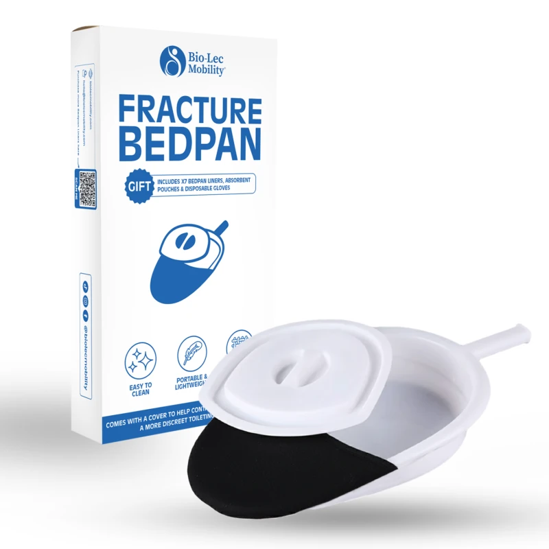 Fracture bedpan with handle and lid next to its packaging.
