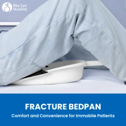 Person using a fracture bedpan with a blue background.