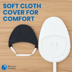White bed pan with handle and black cloth cover on wooden surface.