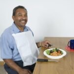 Disposable Adult Bibs with Front Pocket - Perfect for Dining, Dental & Care Needs - Image 1