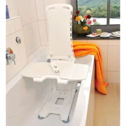 Nova Bath Lift positioned in a bathtub with flowers and towels nearby.