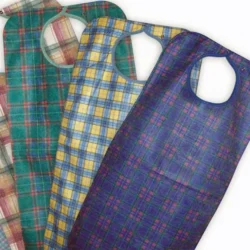 Four adult aprons in different check patterns laid out.