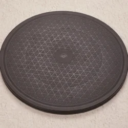 Black round transfer turntable with textured surface.