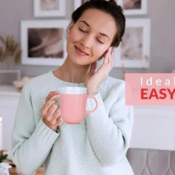 Woman holding a pink two handled mug with text 'Ideal for Easy Grip'.