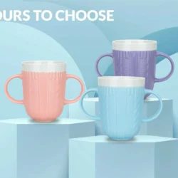 Three two-handled mugs in pink, blue, and purple on display.