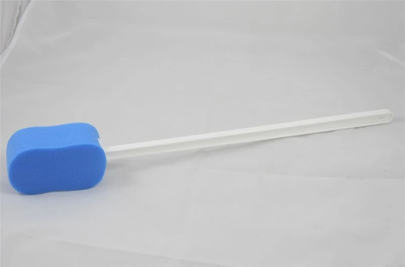 Blue bath sponge with a long white handle on a plain background.