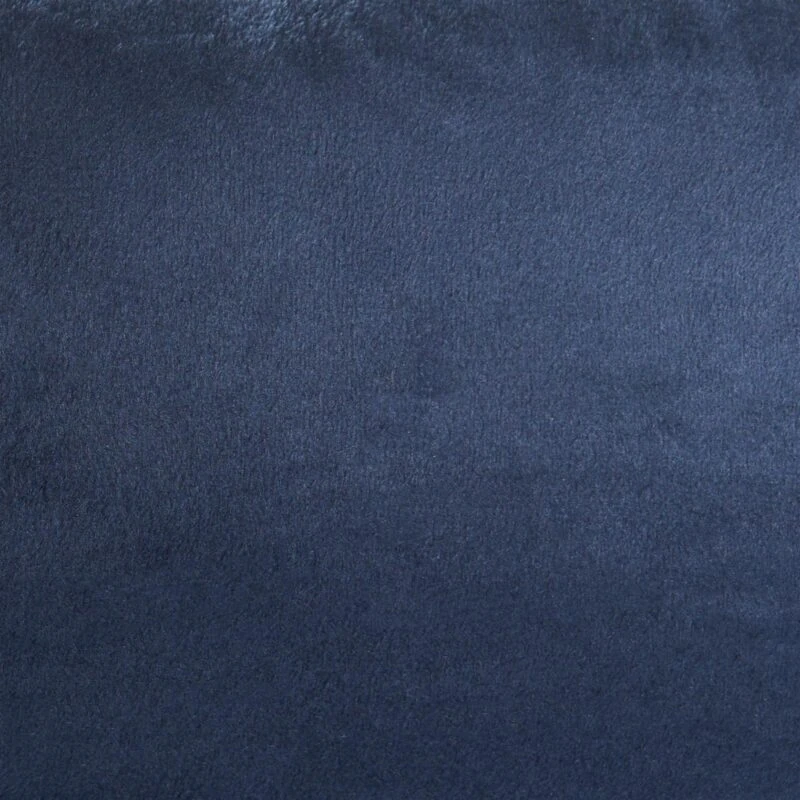Close-up of navy matte velvet fabric texture.
