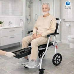 Elderly man sitting on a 3-in-1 shower commode wheelchair in a bathroom.