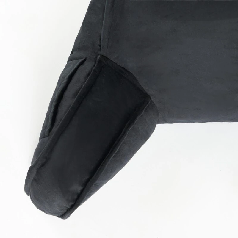 Close-up of black cuddle cushion arm on white background.