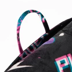 Close-up of a colorful handle on a black cushion.