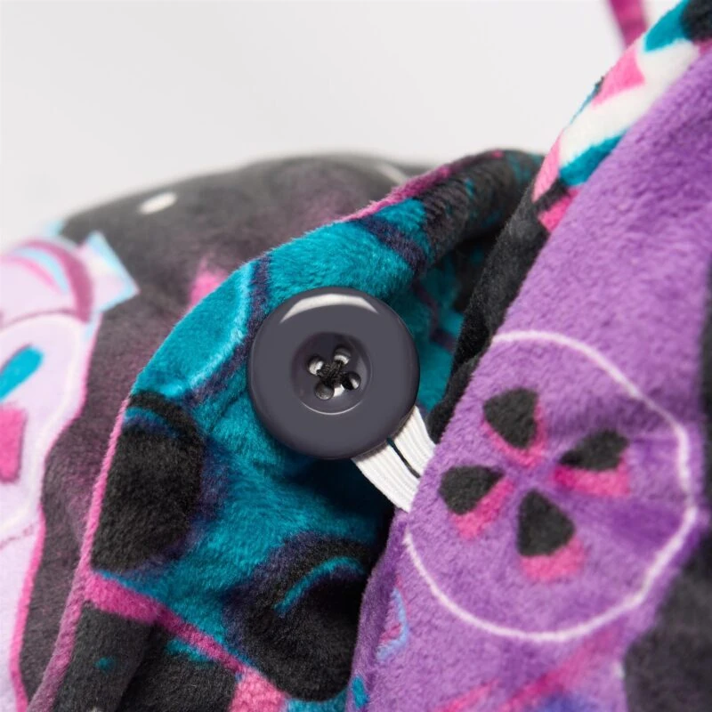 Close-up of colorful velvet fabric with a button detail.