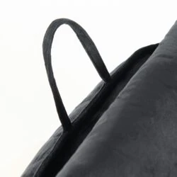 Close-up of the handle on a black Cuddle Cushion.