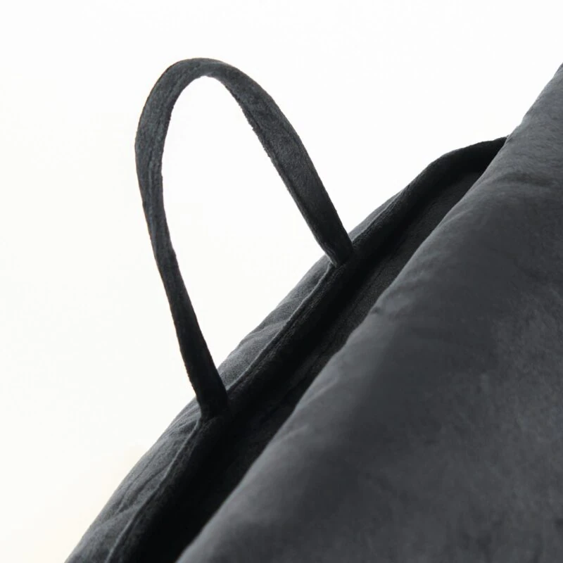 Close-up of the handle on a black Cuddle Cushion.