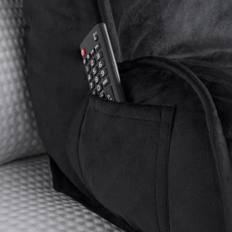 Black Cuddle Cushion with a remote control in its pocket.