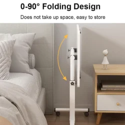 Over bed table tray folded upright beside a bed with a nightstand.