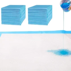 Stacks of blue disposable bed pads with liquid being poured onto one.