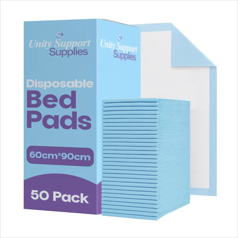 Stack of blue disposable bed pads next to packaging box.
