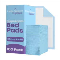 Stack of blue disposable bed pads next to packaging box.
